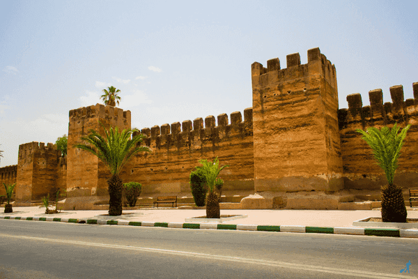 Palms and old building in a road, Taroudant.